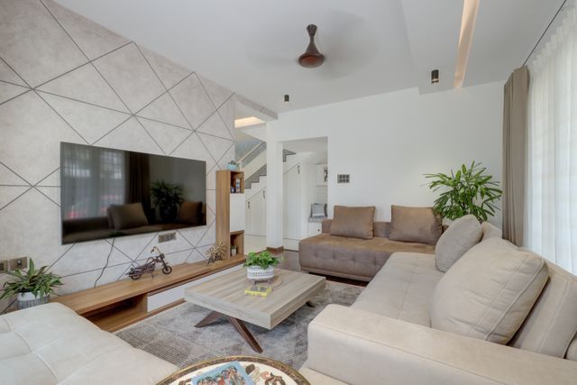 living room with large television and two couches