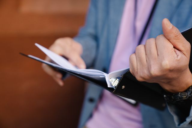 Person homding a binder