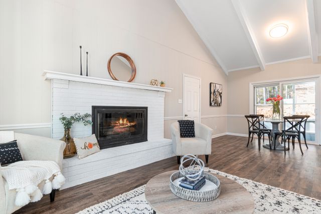 a fire place next to a white chair