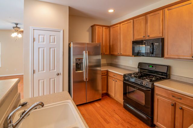 kitchen with brown countertops and cupboards