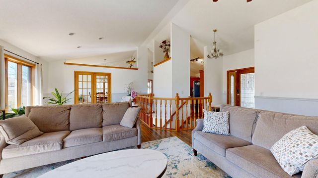room with two grey couches and round table