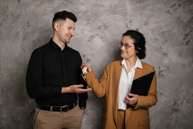 landlord passing keys to a tenant